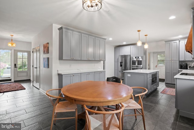 dining space featuring an inviting chandelier