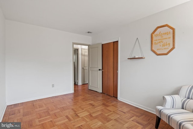 sitting room featuring light parquet floors