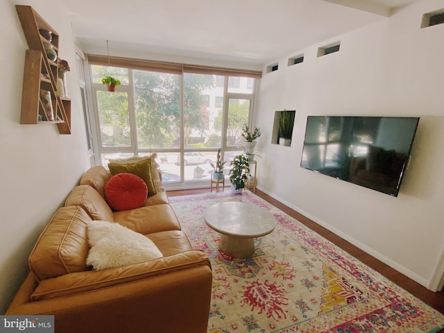 living room featuring visible vents and baseboards