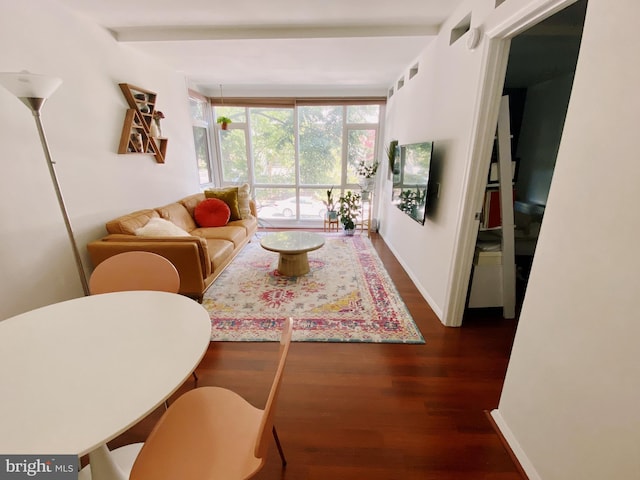 living room with dark wood-style flooring and baseboards