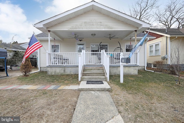 bungalow featuring a porch and a front yard