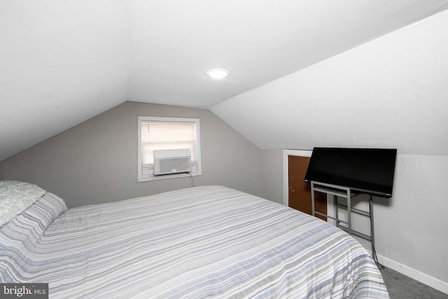 carpeted bedroom featuring vaulted ceiling, cooling unit, and baseboards