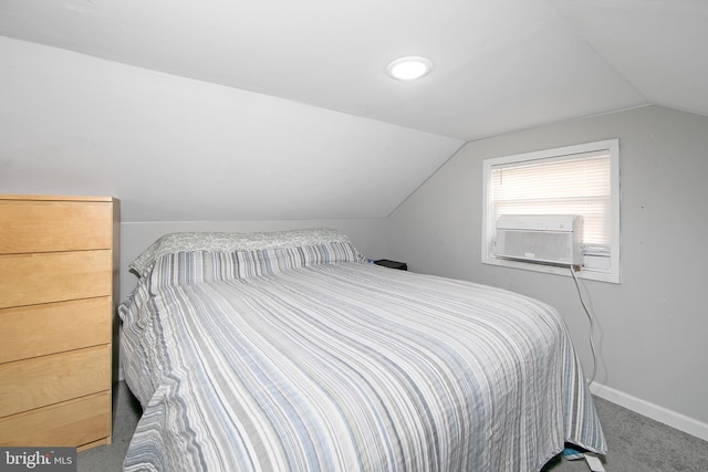 carpeted bedroom featuring vaulted ceiling, cooling unit, and baseboards