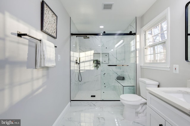 full bath with marble finish floor, a marble finish shower, visible vents, toilet, and baseboards