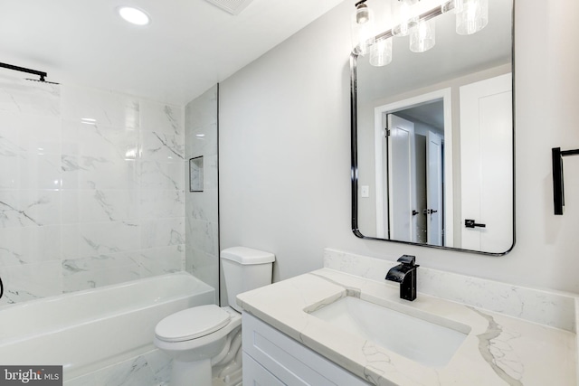 bathroom with marble finish floor, recessed lighting, toilet, tub / shower combination, and vanity