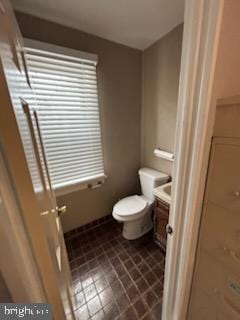 bathroom with vanity and toilet