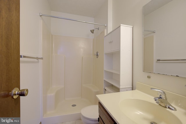 full bathroom with toilet, walk in shower, and vanity