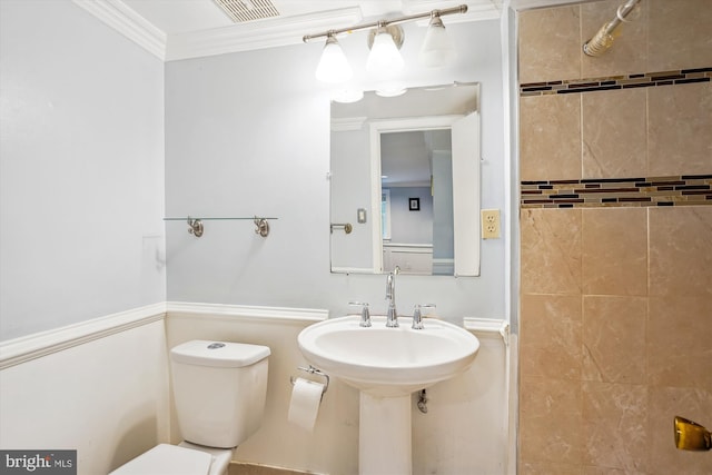 bathroom featuring toilet, visible vents, and ornamental molding