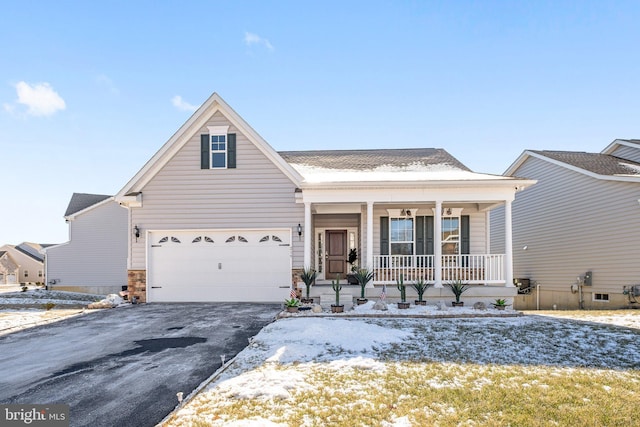 view of front of property with a garage and a porch