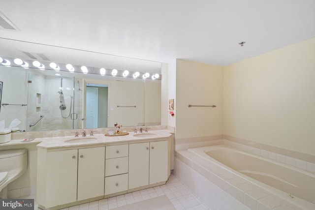 full bathroom featuring a bath, a stall shower, toilet, and a sink