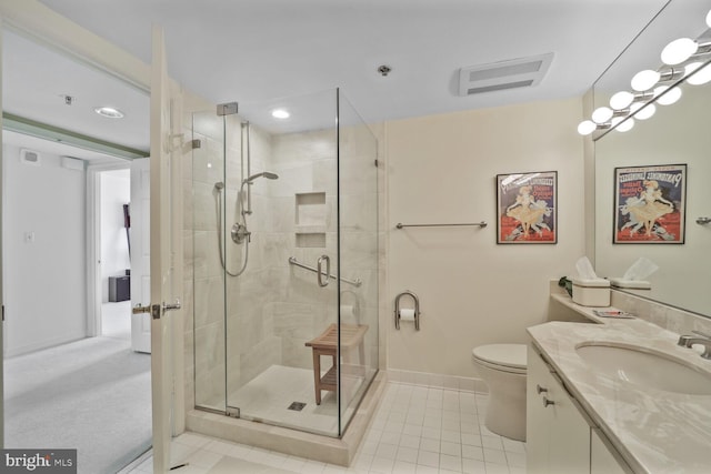 full bathroom featuring visible vents, toilet, a stall shower, vanity, and tile patterned floors