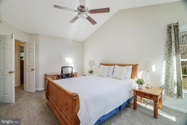 bedroom with lofted ceiling, baseboards, a ceiling fan, and light colored carpet