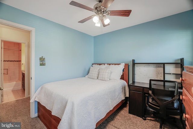 tiled bedroom with ceiling fan, carpet, and connected bathroom