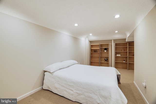 bedroom featuring recessed lighting, carpet, and baseboards