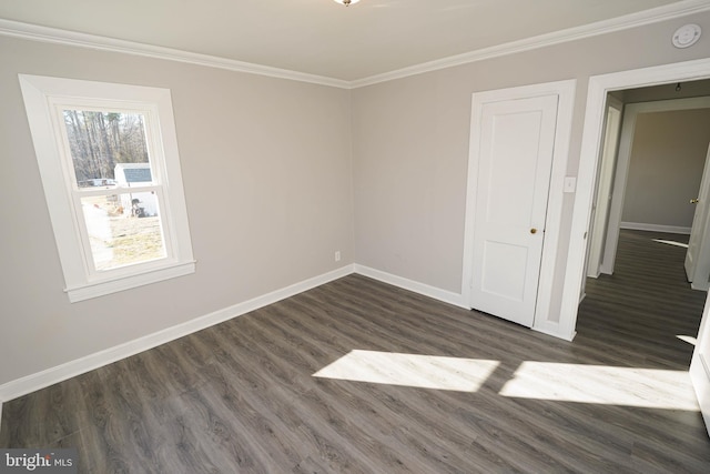 unfurnished bedroom featuring crown molding and dark hardwood / wood-style floors