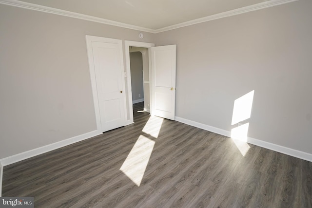 interior space featuring crown molding and dark wood-type flooring