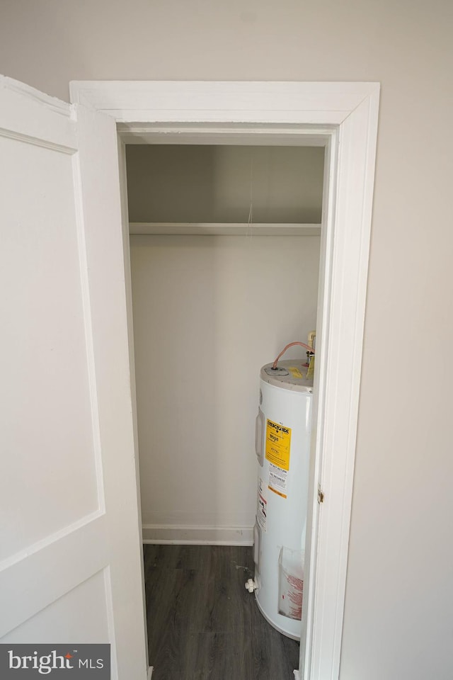 utility room featuring water heater