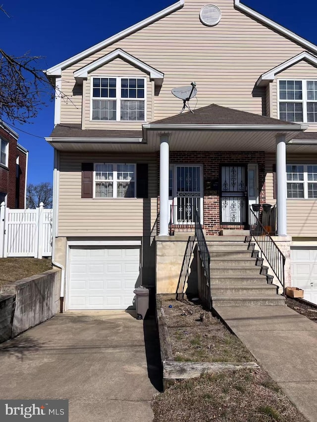 view of front of property with a garage and covered porch