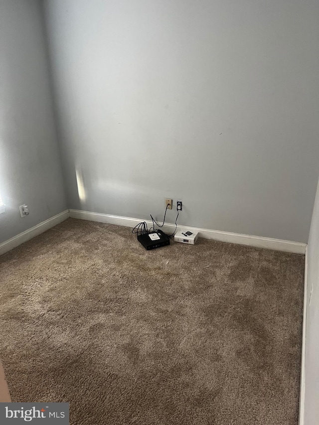 empty room with carpet flooring