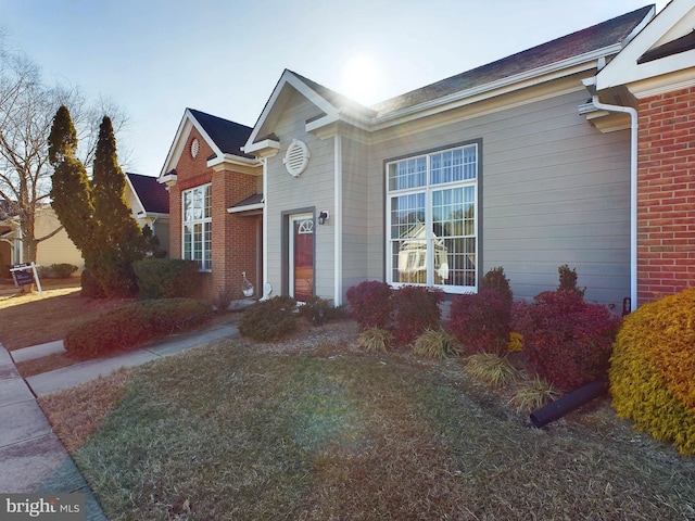 ranch-style house with a front lawn