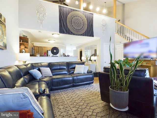 living room featuring a high ceiling