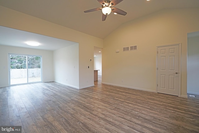 empty room with ceiling fan, wood finished floors, visible vents, and baseboards