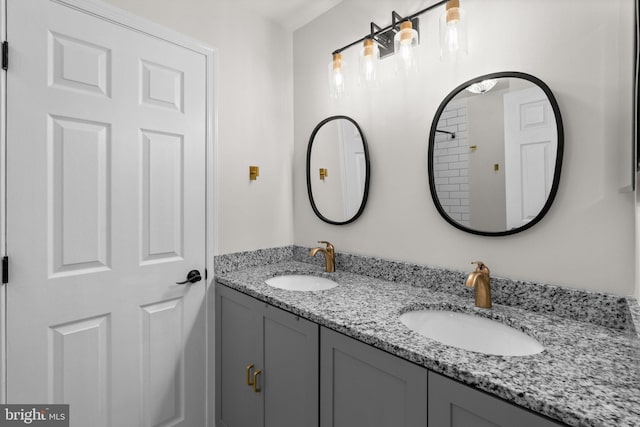 full bath featuring a sink and double vanity