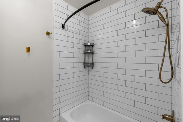 bathroom with bathing tub / shower combination