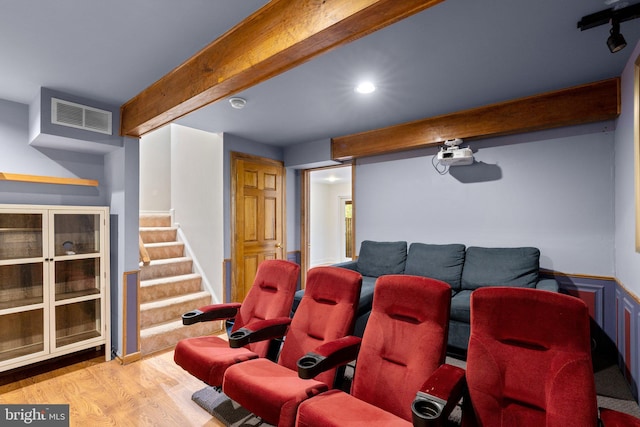 home theater featuring recessed lighting, wood finished floors, visible vents, and beam ceiling