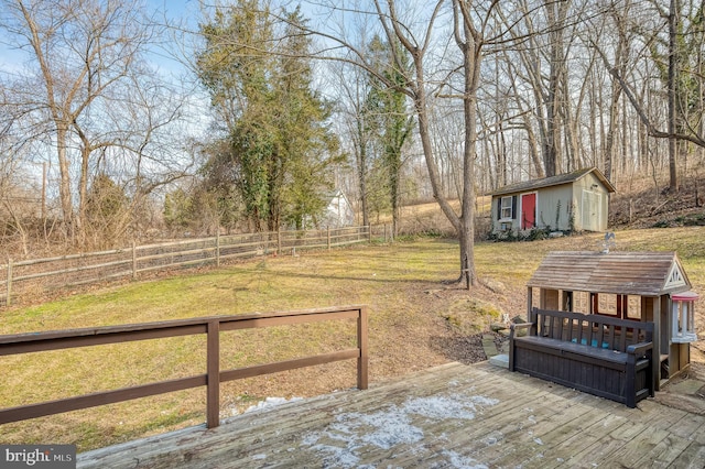 view of yard with a deck and an outdoor structure