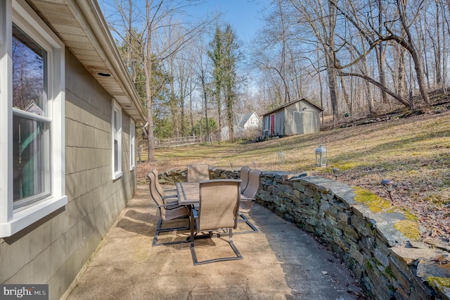 view of patio / terrace with a shed