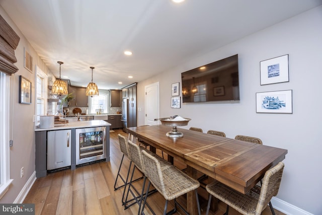 interior space with wine cooler and hardwood / wood-style flooring