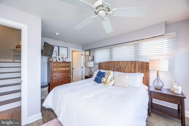 bedroom featuring ceiling fan and hardwood / wood-style floors