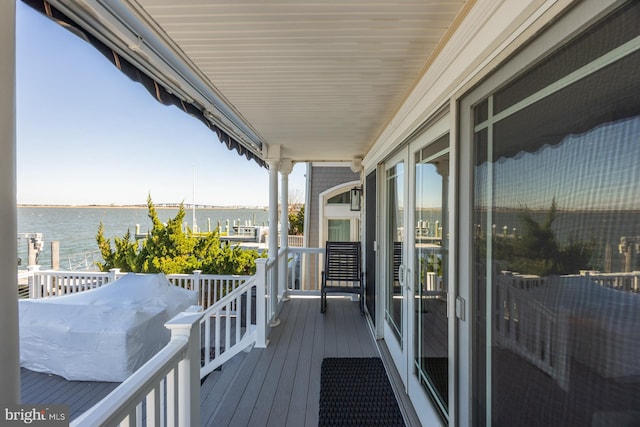 balcony featuring a water view