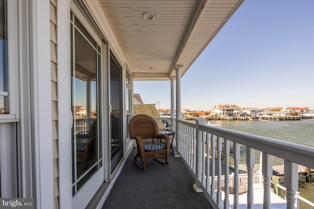 balcony featuring a water view