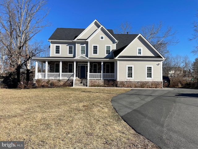 view of front of home featuring a porch and a front lawn