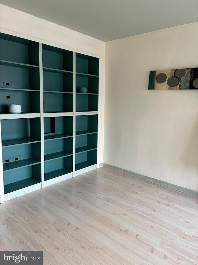 unfurnished room featuring light hardwood / wood-style flooring