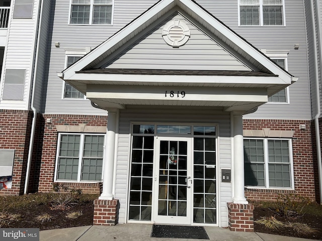 property entrance featuring french doors