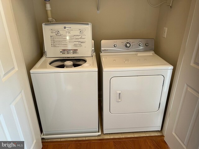 laundry area with laundry area and independent washer and dryer
