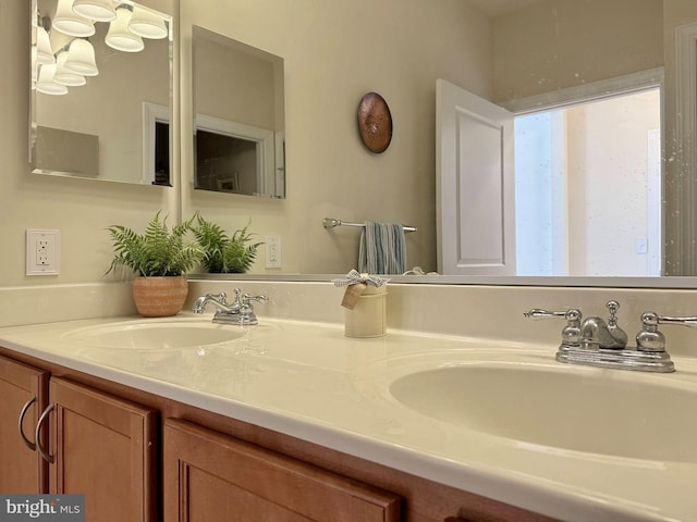 bathroom featuring double vanity and a sink