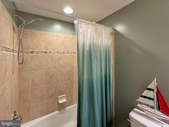 full bath with toilet and shower / bath combo