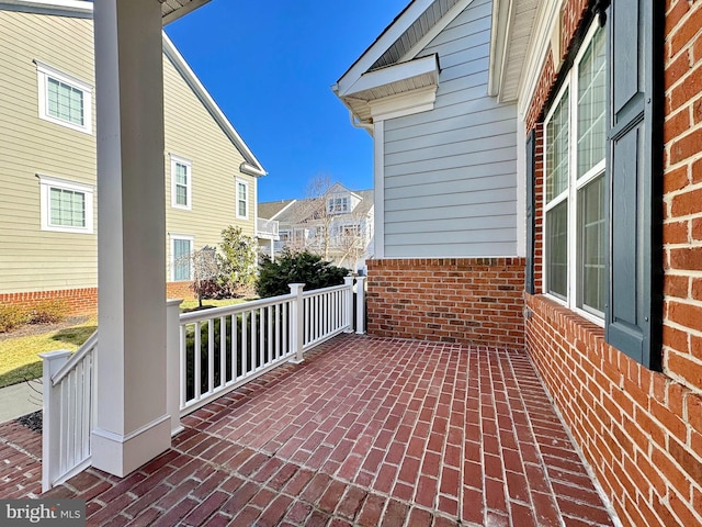 view of patio / terrace featuring a residential view and a porch