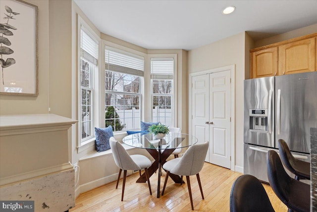 dining space featuring recessed lighting, light wood-type flooring, and baseboards