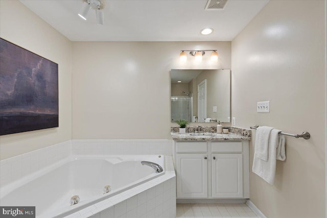 full bath featuring tile patterned flooring, visible vents, a shower stall, a garden tub, and vanity