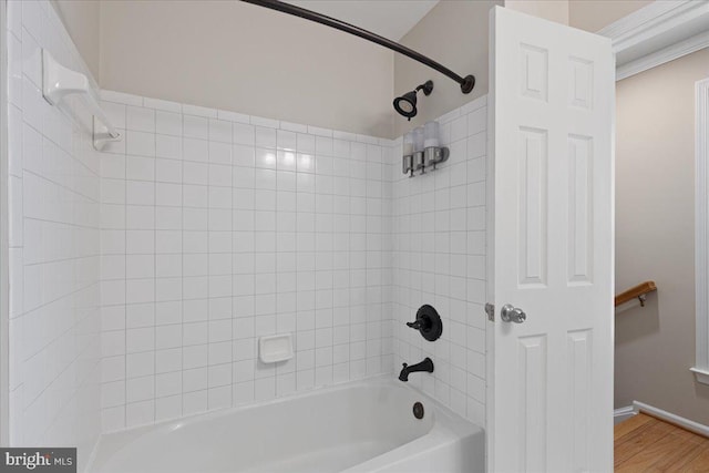 full bathroom featuring shower / tub combination and wood finished floors