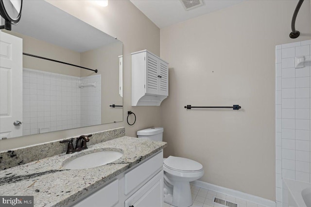 bathroom with vanity, toilet, baseboards, and visible vents