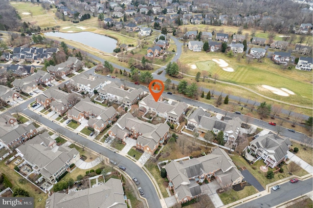 aerial view featuring a residential view, a water view, and golf course view