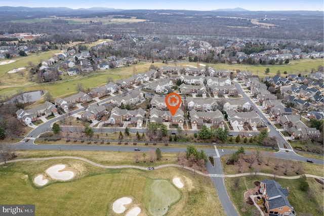 drone / aerial view featuring a residential view and view of golf course