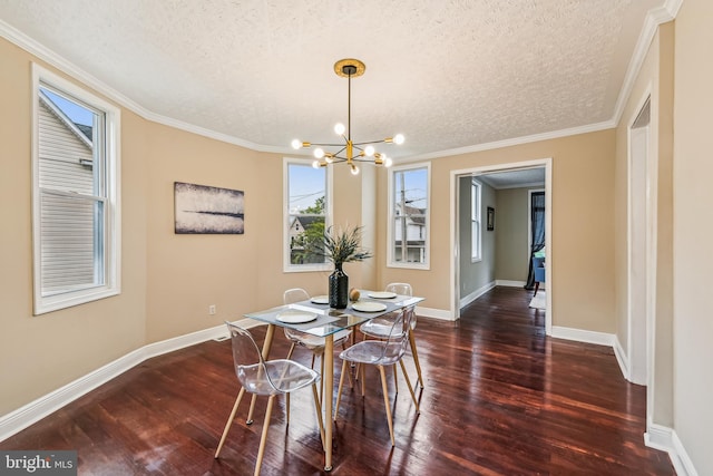 dining space featuring crown molding, a chandelier, dark wood-type flooring, and a textured ceiling