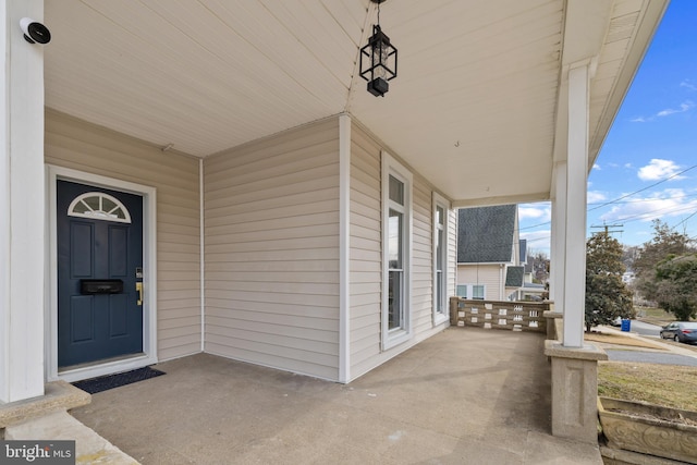 doorway to property with covered porch